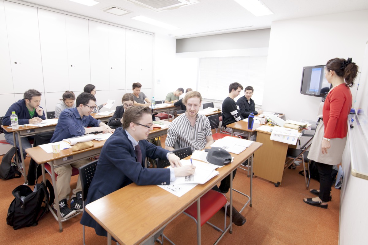 Students studying in a classroom at Kudan while a teacher gives a lesson